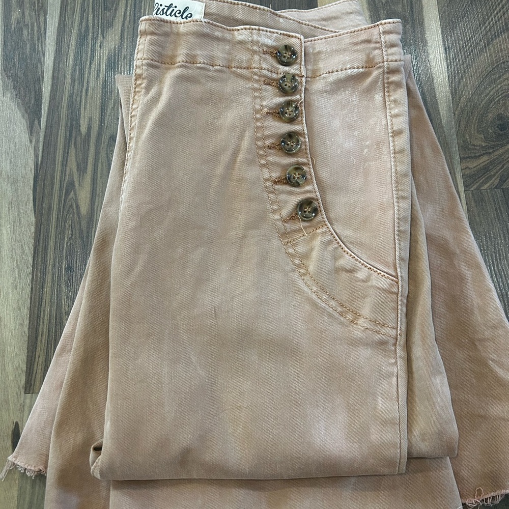 Listicle peach colored low rise flare jeans
